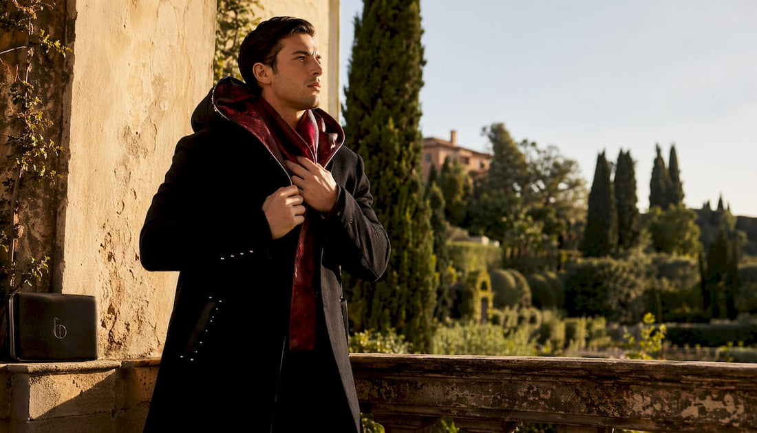 Male model in luxury tailored overcoat in marble hallway